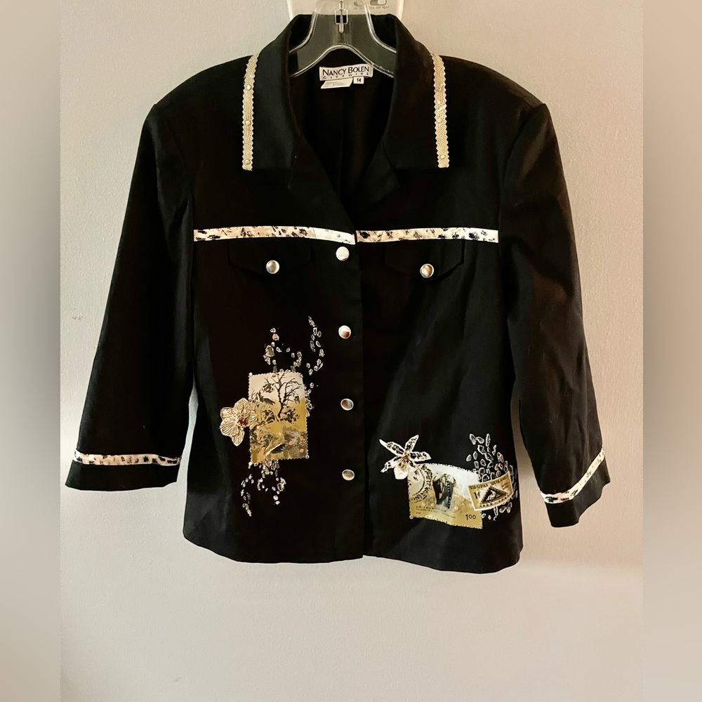 Vintage Nancy Boleyn size 14 adorned with multi embellishments.